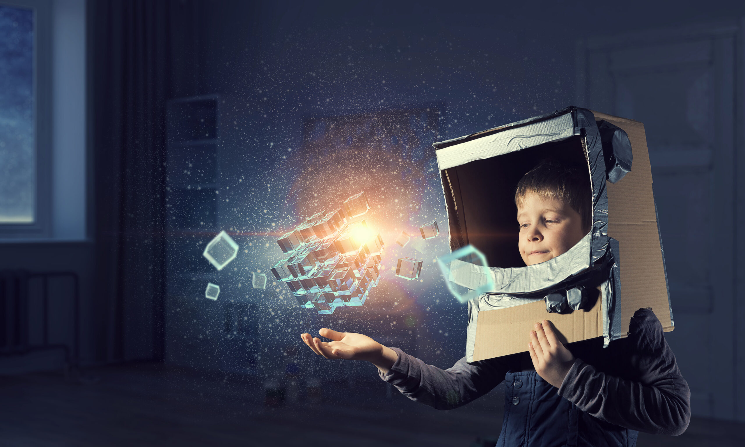 A boy and a media cube serve as symbols of technology.